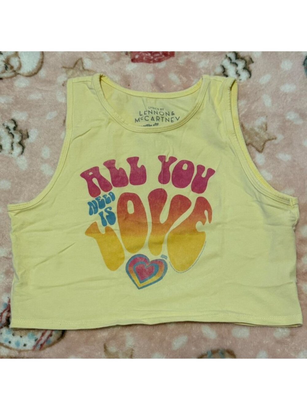 Lennon & McCartney yellow crop top with 'ALL YOU NEED IS LOVE'